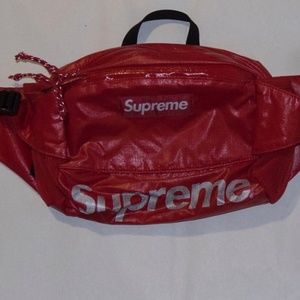 red and gray Supreme bag